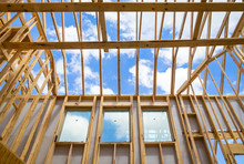 New Construction Home Framing Against Sky