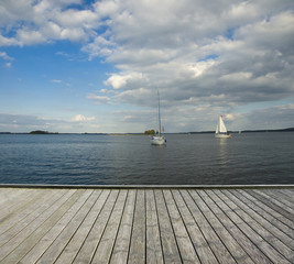 Canvas Print - Wooden jetty and yachts