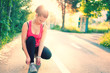 © aboutmomentsimages - woman running workout on spring sunny sunset. Fitness girl