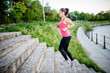 © aboutmomentsimages - healthy lifestyle sports woman running on street stairs