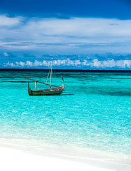 Little fishing boat in blue sea