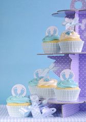 Wall Mural - Blue theme baby boy cupcakes on purple polka dot cupcake stand