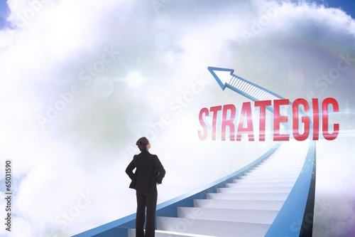Fotografía Strategic against red staircase arrow pointing up against sky