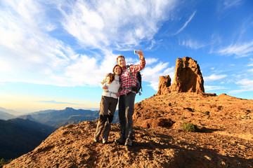 couple taking selfie hiking in beautiful nature