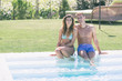 © william87 - Beautiful Young Couple Next to Swimming Pool