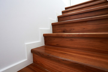 wooden staircase in a white modern house