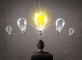 Business person having an idea light bulb concept