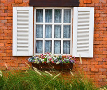 Open White Window On Red Brick Wall