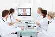 © Andrey Popov - Doctors Attending Video Conference