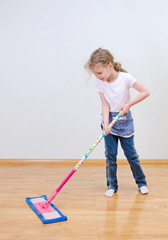 Wall Mural - Little cute girl mopping floor at home.