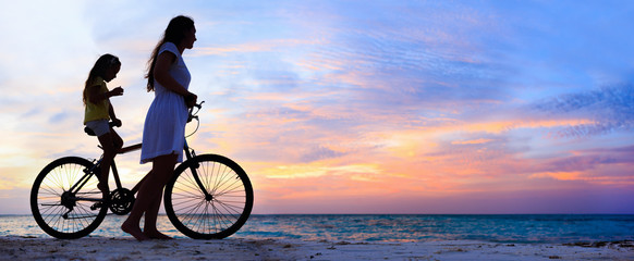 Wall Mural - mother and daughter on a bike