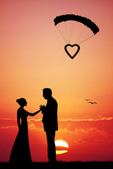 Wall Mural - Bride and groom at sunset