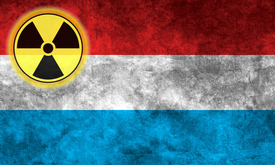 Wall Mural - Grunge flag background with nuclear sign - Luxembourg