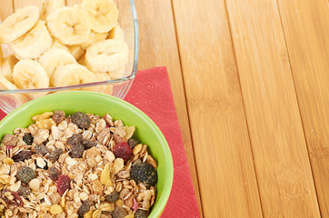 Plate with raw oatmeal on wooden table.