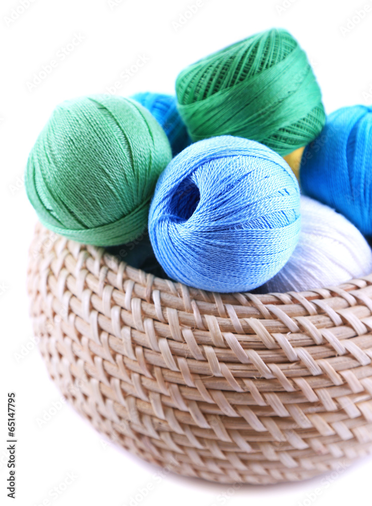 Colorful clews and crochet hooks in box isolated on white