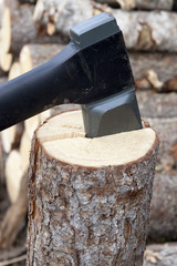 Axe  prick to the tree and splitting it into two parts.