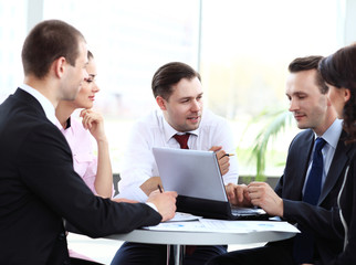 Canvas Print - business partners discussing documents and ideas at meeting 