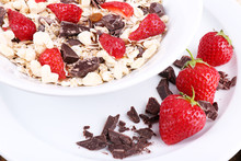 Healthy Cereal In Bowl With Strawberries And Chocolate Close Up
