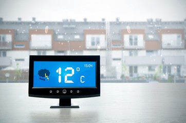 Wall Mural - Weather station device with weather conditions outside backgroun