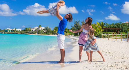 Canvas Print - Happy family with two kids on summer vacation