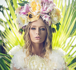 Portrait of the beautiful woman with flowery hat