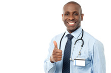 Smiling Medical Doctor Showing Thumbs Up