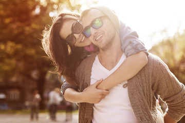 Young couple have fun in sunny day