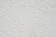 White rough plaster on wall