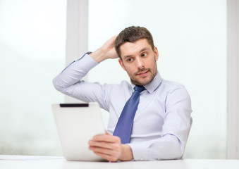 Wall Mural - stressed businessman with tablet pc and documents