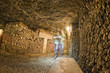 a ghost shape inside Paris Catacombs Skulls and bones