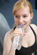 young beautiful woman drinking mineral water