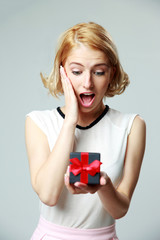 Poster - woman holding an open jewelery gift box