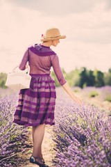 Sticker - Woman in purple dress and hat with basket in lavender field