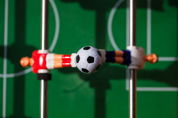 football - board game with players, soccer ball and green field