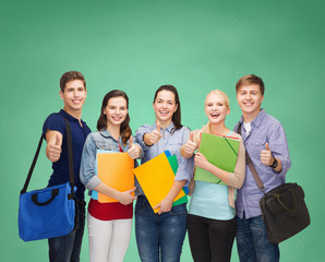 Wall Mural - group of smiling students showing thumbs up