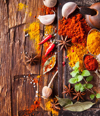 Wall Mural - Various spices on wood
