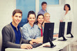 © Syda Productions - students with computer monitor at school