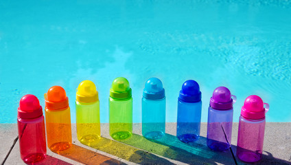 Wall Mural - Color water bottles  by the pool