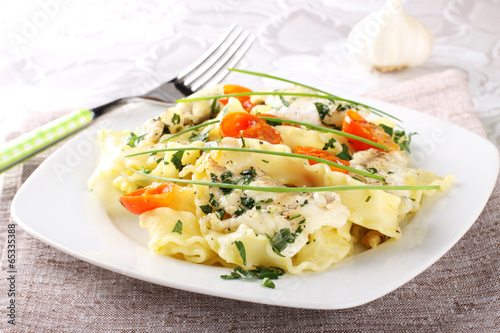 Fotografering Pasta with seafood, tomatoes and chives