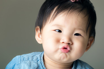 asian baby girl purse lip