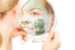 © Voyagerix - Skin care. Woman in clay mud mask on face. Beauty.