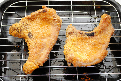 Fotografie, Obraz Two Crispy Cooked Pork Chops Hot From the Oven