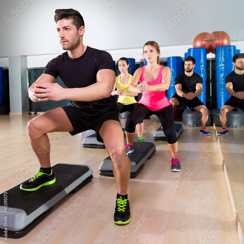 Fotografía Cardio step dance squat group at fitness gym