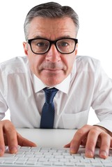 Poster - Mature businessman typing on keyboard