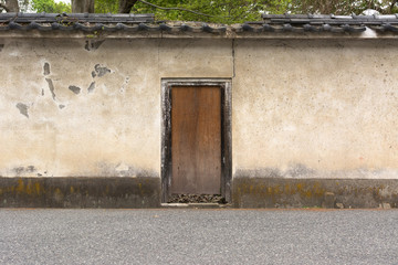 Japanese style wooden door and old wall