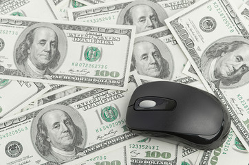 US Dollars and Computer Mouse