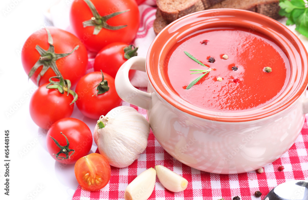 Tasty tomato soup and vegetables, isolated on white