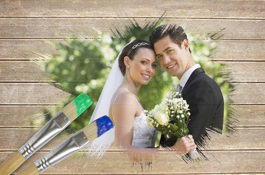 Composite image of newlyweds smiling at camera