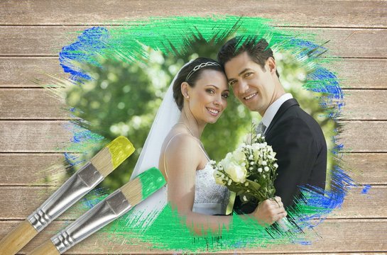 Composite image of newlyweds smiling at camera