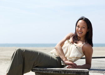 Wall Mural - Pretty young woman relaxing outdoors